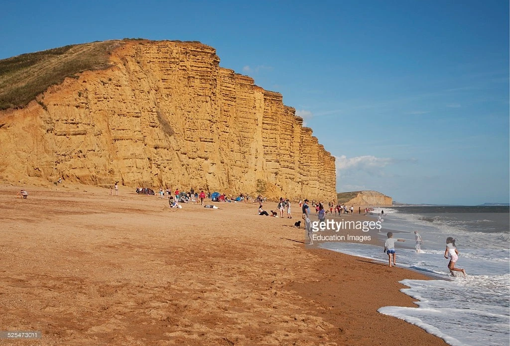 sandstone-cliffs-and-beach-west-bay-bridport-dorset-england-picture-id525473011.webp