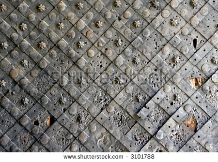 stock-photo-medieval-iron-door-damaged-during-battle-3101788.webp