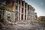 33041289-abandoned-houses-and-ruined-city-wet-and-muddy.webp